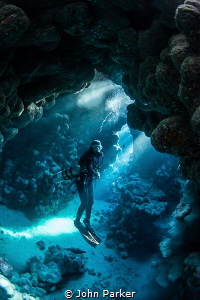 Diver In Caves by John Parker 
